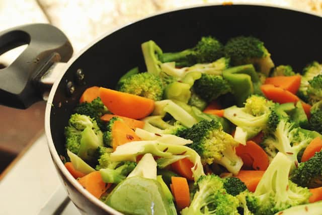Cooked vegetables in a pan.