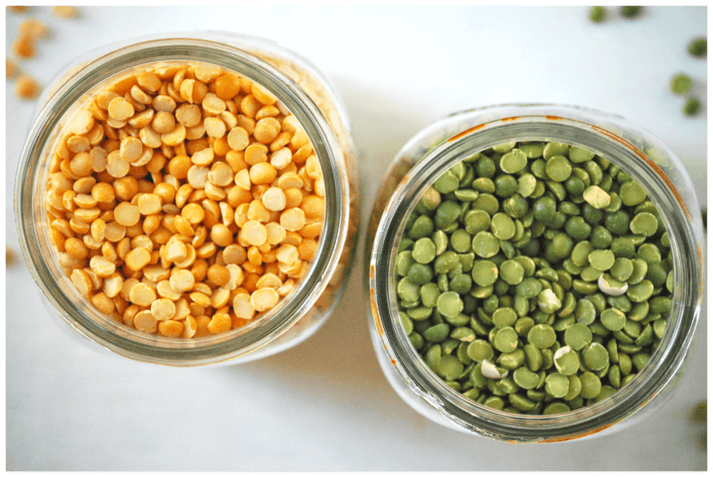 yellow and green split peas in two separate clear browns on countertop
